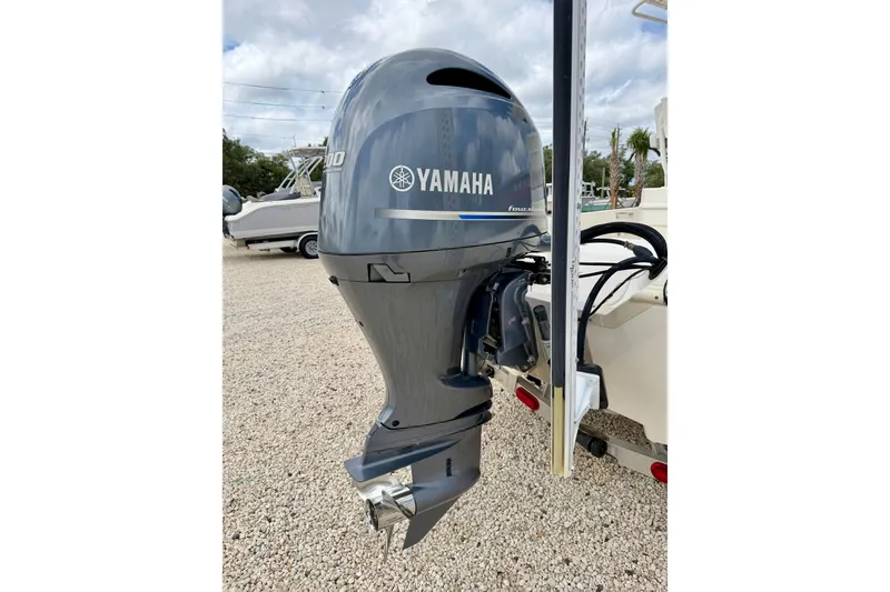 Slide: The Image of 2018 Skeeter SX2250 with Yamaha outboard motor, parked on gravel. - 35