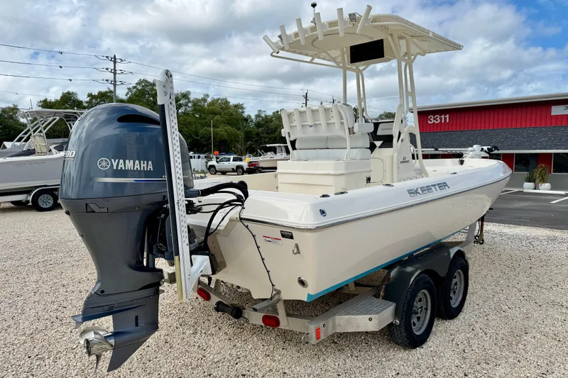 Slide: The Image of 2018 Skeeter SX2250 boat with Yamaha engine on trailer, parked outdoors. - 5