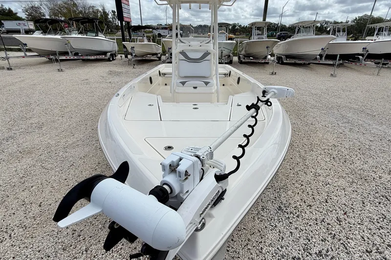 Slide: The Image of 2018 Skeeter SX2250 boat with trolling motor, displayed on gravel lot. - 8