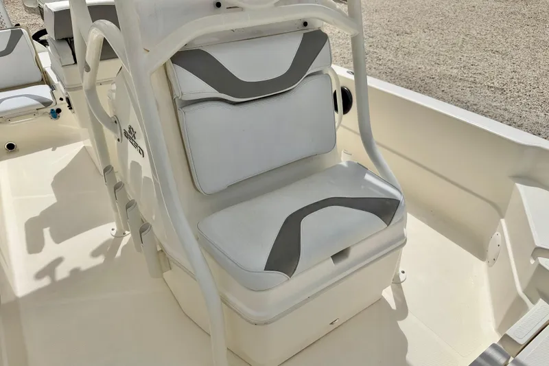 Slide: The Image of 2018 Skeeter SX2250 boat interior with white cushioned seating and storage. - 9