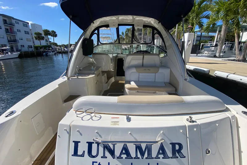 Slide: The Image of 2008 Sea Ray Sundancer 330 docked, featuring spacious seating and elegant design. - 22