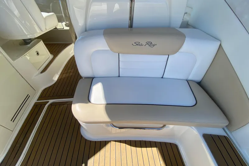 Slide: The Image of 2008 Sea Ray Sundancer 330 interior with beige and white seating on teak flooring. - 28