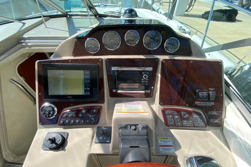 Slide: The Image of 2008 Sea Ray Sundancer 330 helm with navigation system and control panel. - 34