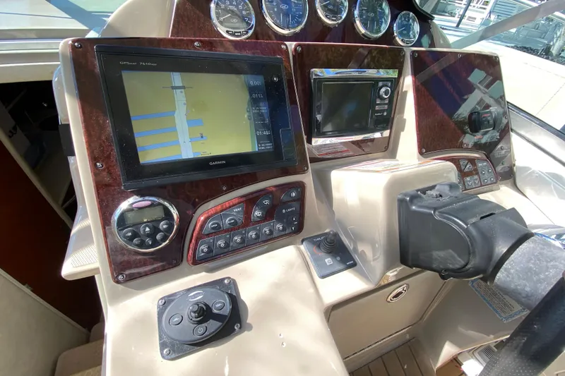 Slide: The Image of 2008 Sea Ray Sundancer 330 dashboard with navigation and control systems. - 37