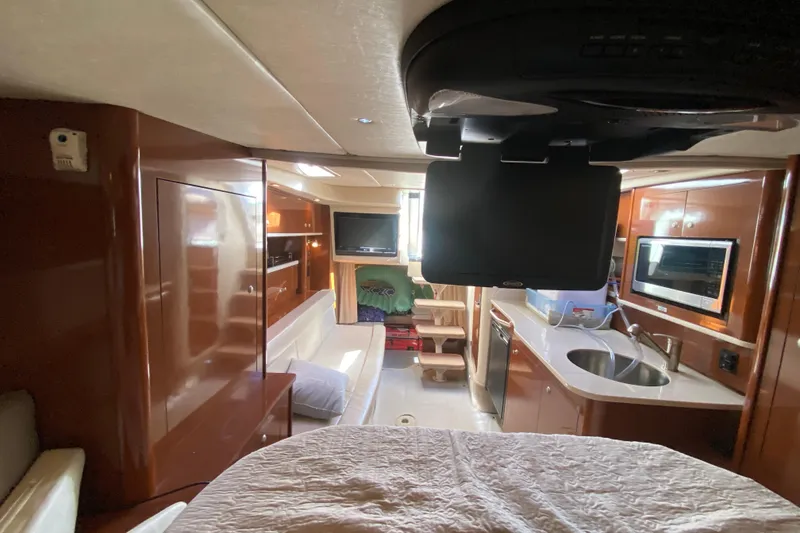 Slide: The Image of Interior of 2008 Sea Ray Sundancer 330 yacht with modern amenities and wood finishes. - 45