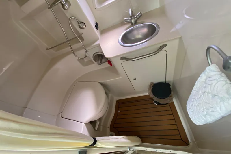 Slide: The Image of Compact bathroom in 2008 Sea Ray Sundancer 330 yacht with sink, toilet, and shower. - 47