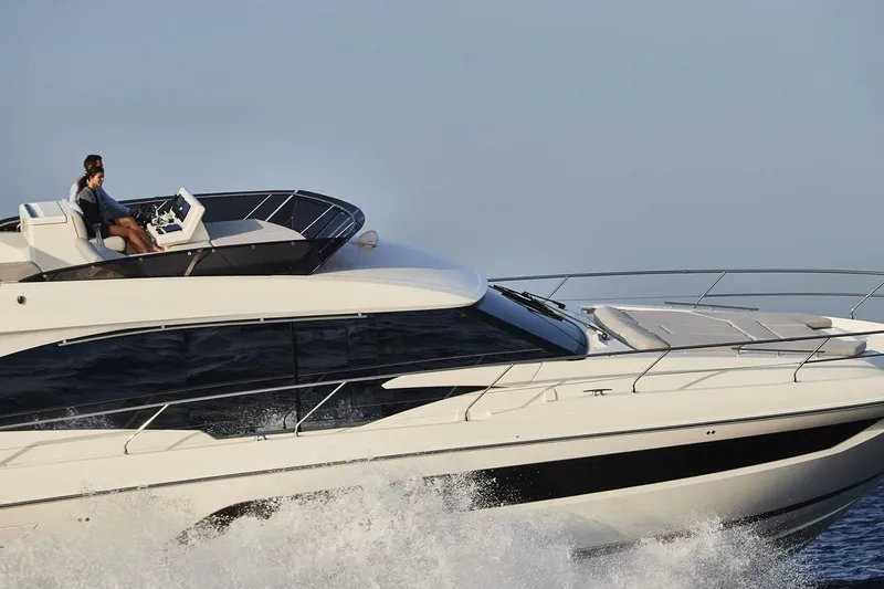 Slide: The Image of Luxurious interior of 2020 Prestige 590 yacht with modern furnishings and ocean view. - 10