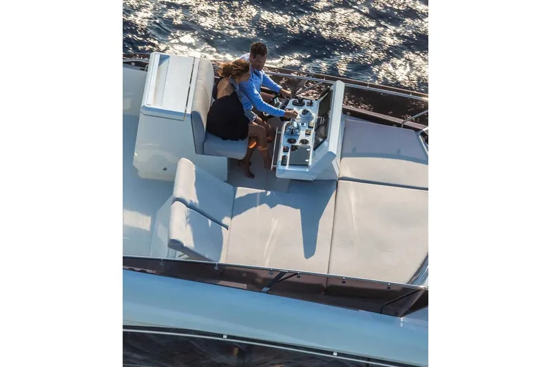 Slide: The Image of Luxurious interior of 2020 Prestige 590 yacht with modern seating and panoramic windows. - 13