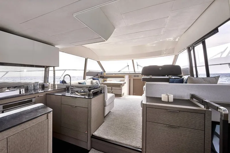 Slide: The Image of Prestige 590 2020 yacht cabin with twin beds and modern interior design. - 18
