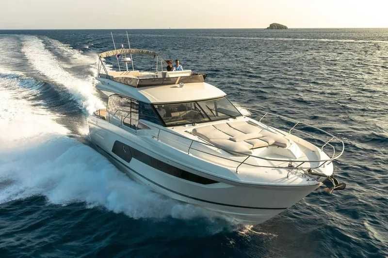 Slide: The Image of 2020 Prestige 590 yacht cruising on open water. - 3