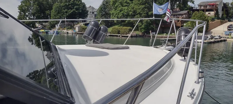 Slide: The Image of 1989 Carver 32 Convertible yacht at lakeside dock. - 10