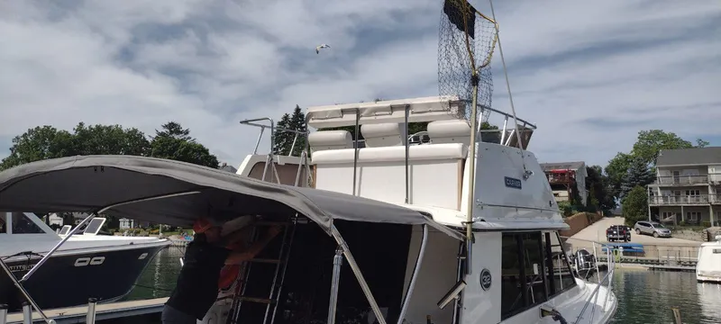 Slide: The Image of 1989 Carver 32 Convertible yacht docked at marina. - 11