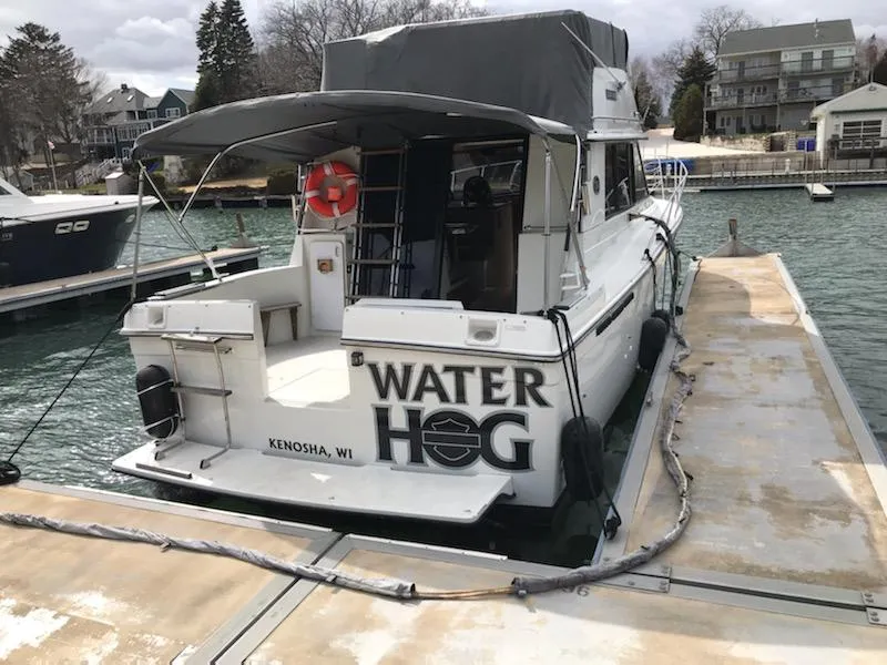 Slide: The Image of 1989 Carver 32 Convertible boat docked in Kenosha, WI. - 12