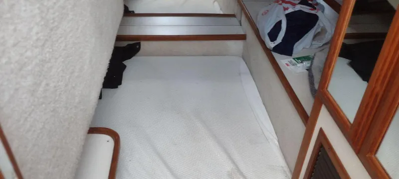 Slide: The Image of Interior of 1989 Carver 32 Convertible with sleeping area. - 13