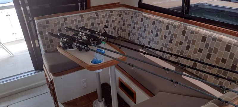 Slide: The Image of Interior of a 1989 Carver 32 Convertible with fishing rods. - 26