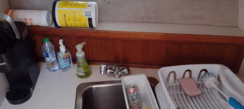 Slide: The Image of Kitchen area in a 1989 Carver 32 Convertible boat. - 27