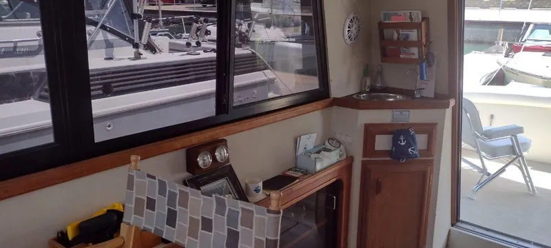 Slide: The Image of Interior of a 1989 Carver 32 Convertible yacht with wooden furnishings. - 29