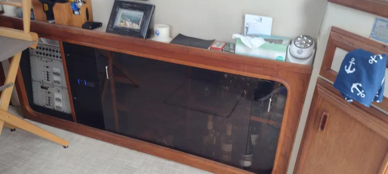 Slide: The Image of Interior of a 1989 Carver 32 Convertible with wooden furnishings. - 30