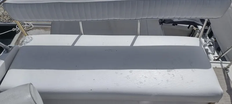 Slide: The Image of White bench seat on a 1989 Carver 32 Convertible boat. - 38