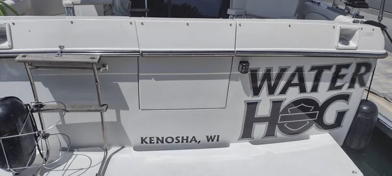 Slide: The Image of Rear view of 1989 Carver 32 Convertible named "Water Hog", Kenosha, WI. - 4