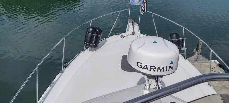 Slide: The Image of Bow of a 1989 Carver 32 Convertible with Garmin equipment. - 40