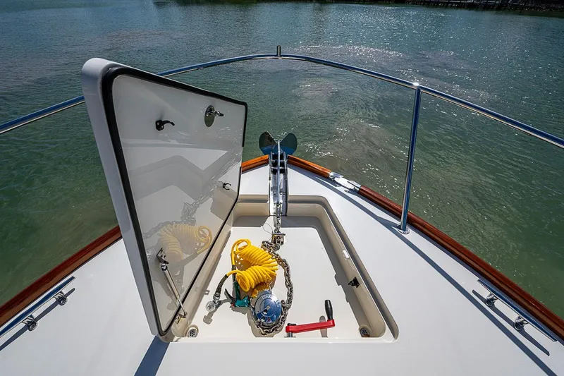 Slide: The Image of Bow of 2021 Hinckley Talaria 43 yacht with open anchor locker and equipment. - 23