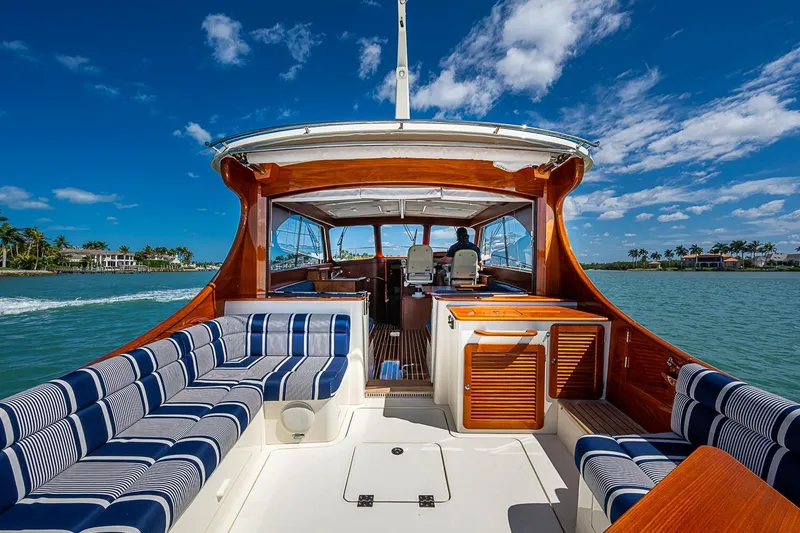 Slide: The Image of 2021 Hinckley Talaria 43 yacht with elegant seating, cruising on a sunny day. - 30
