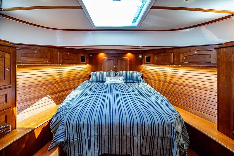 Slide: The Image of Luxurious cabin interior of 2021 Hinckley Talaria 43 yacht with wood paneling and skylight. - 37