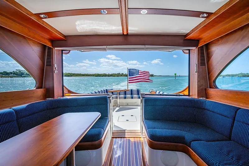 Slide: The Image of Interior of 2021 Hinckley Talaria 43 yacht with elegant wood finish and scenic water view. - 49