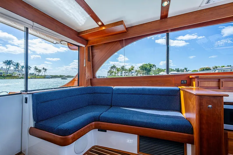 Slide: The Image of Interior of 2021 Hinckley Talaria 43 yacht with elegant wood finish and blue seating. - 51