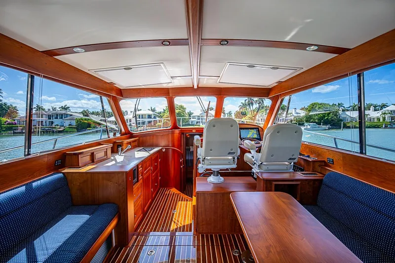 Slide: The Image of Luxurious interior of 2021 Hinckley Talaria 43 yacht with elegant wood finish and scenic views. - 53