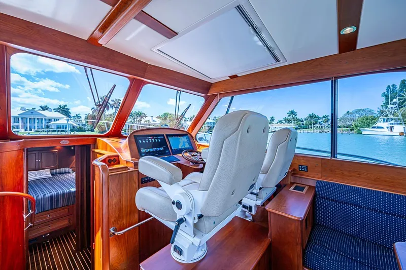 Slide: The Image of Interior of 2021 Hinckley Talaria 43 yacht with luxurious seating and navigation controls. - 55