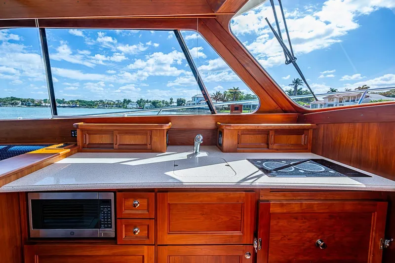 Slide: The Image of Luxurious interior of 2021 Hinckley Talaria 43 yacht with modern kitchen amenities. - 56