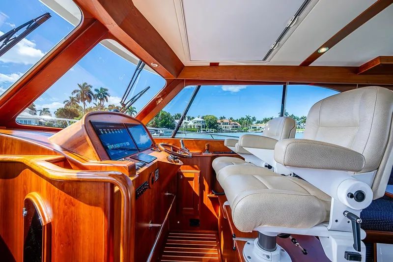 Slide: The Image of Interior of 2021 Hinckley Talaria 43 yacht with luxurious seating and navigation controls. - 59