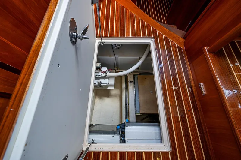 Slide: The Image of Engine compartment of 2021 Hinckley Talaria 43 yacht with wooden interior finish. - 63