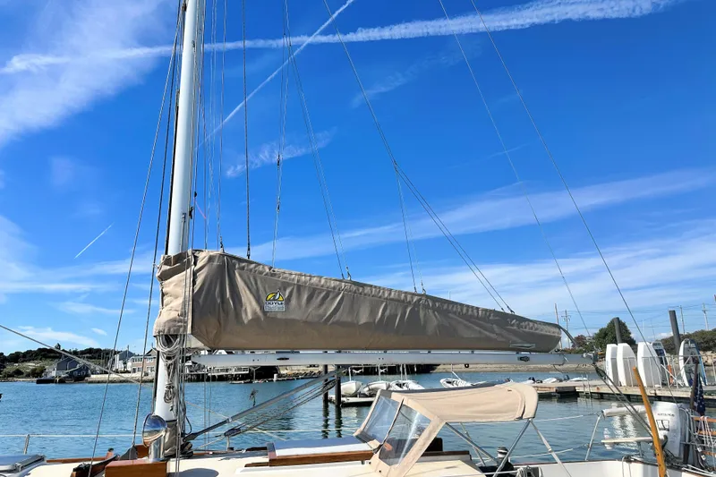 Slide: The Image of Sailboat docked at marina under clear blue sky, Morris Linda 1987 model. - 10