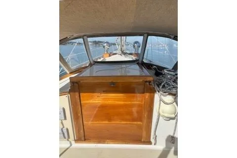 Slide: The Image of 1987 Morris Linda sailboat interior with wooden cabinetry and nautical equipment. - 18