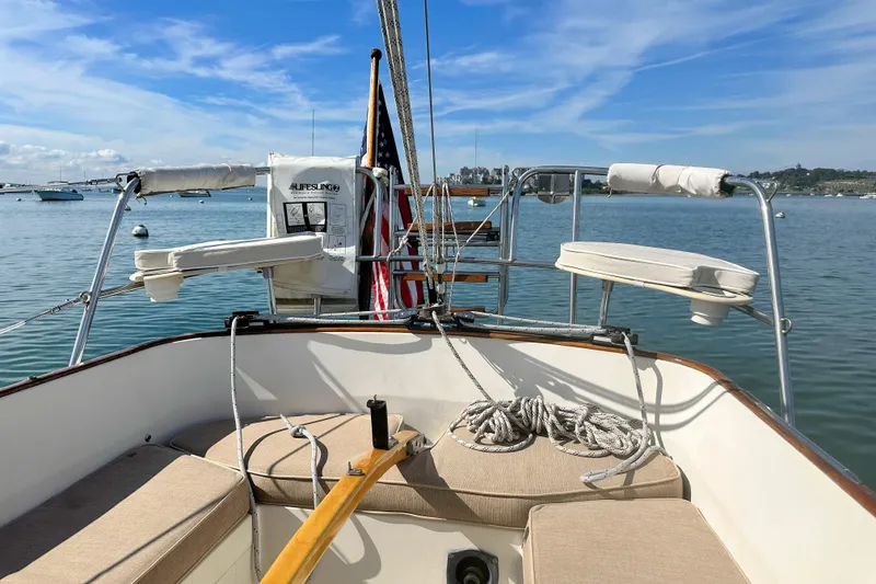 Slide: The Image of Cockpit view of 1987 Morris Linda sailboat on calm water with clear skies. - 20