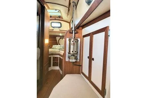 Slide: The Image of 1987 Morris Linda yacht interior with wood paneling and cozy cabin space. - 29