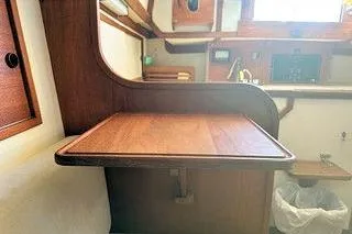 Slide: The Image of 1987 Morris Linda interior with wooden table and cabinetry in a compact space. - 35