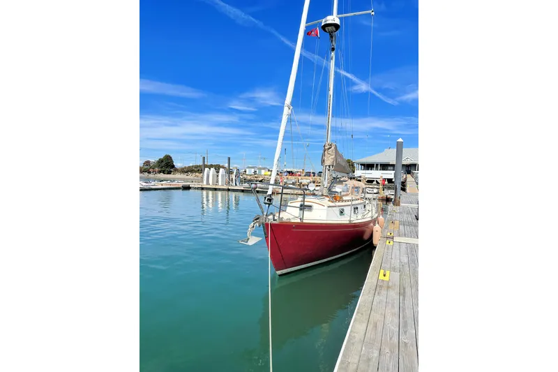 Slide: The Image of Sailboat docked at marina under clear blue sky, Morris Linda 1987 model. - 4