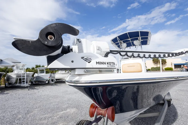 Slide: The Image of 2021 Sportsman Masters 227 Bay Boat on trailer, featuring Minn Kota trolling motor. - 10