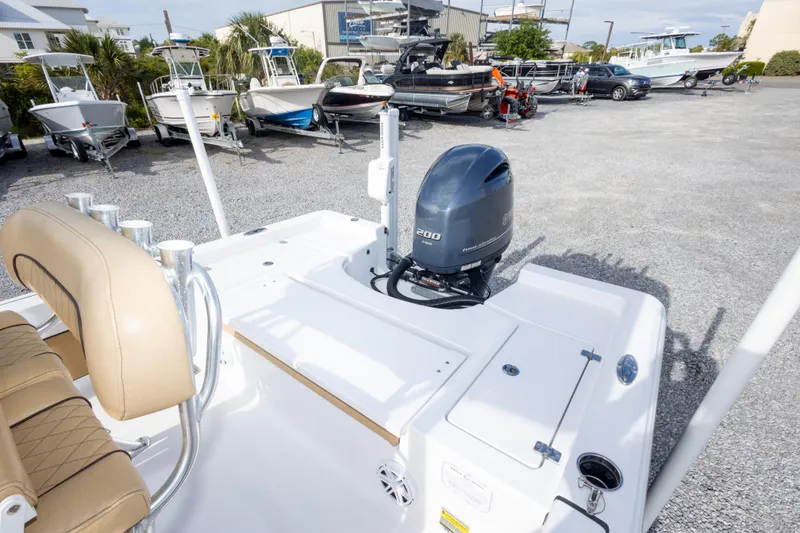 Slide: The Image of 2021 Sportsman Masters 227 Bay Boat dashboard view in a boatyard. - 16