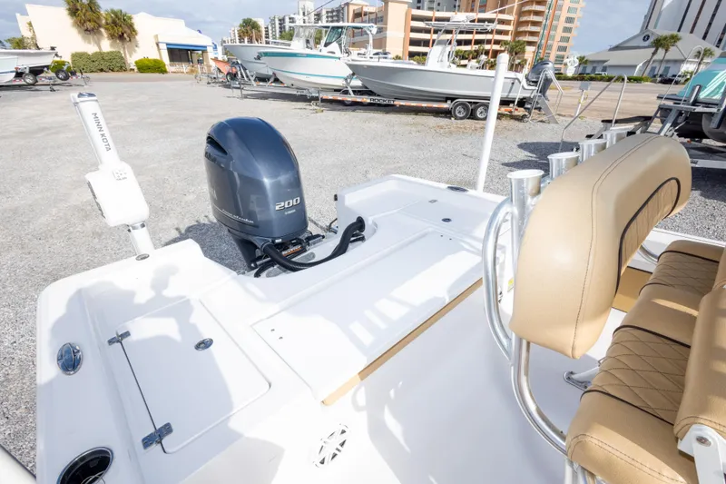 Slide: The Image of 2021 Sportsman Masters 227 Bay Boat with Yamaha 200 engine in a boatyard setting. - 17