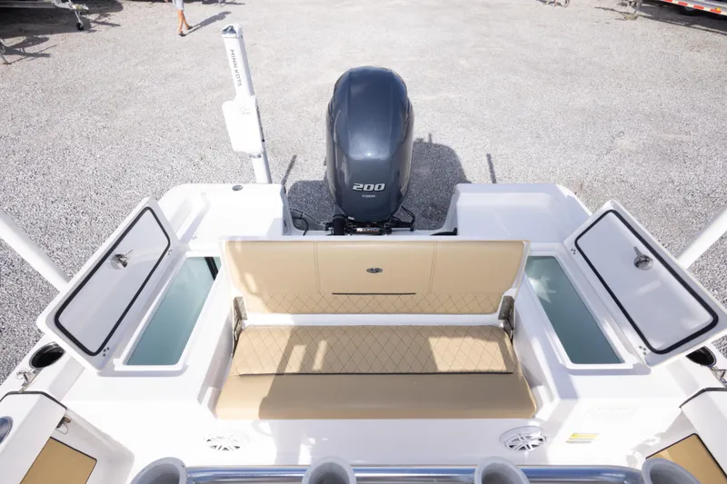 Slide: The Image of 2021 Sportsman Masters 227 Bay Boat with tan seating and Yamaha 200 engine. - 19
