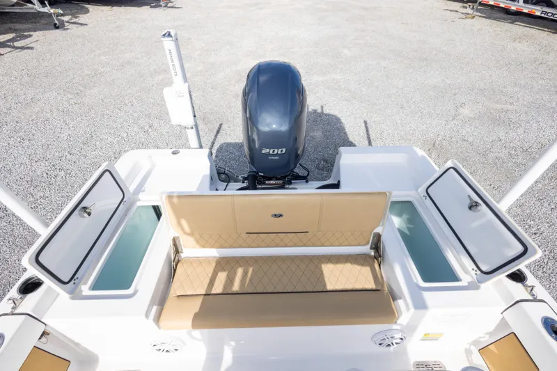 Slide: The Image of 2021 Sportsman Masters 227 Bay Boat with Yamaha 200 engine, open storage compartments. - 20