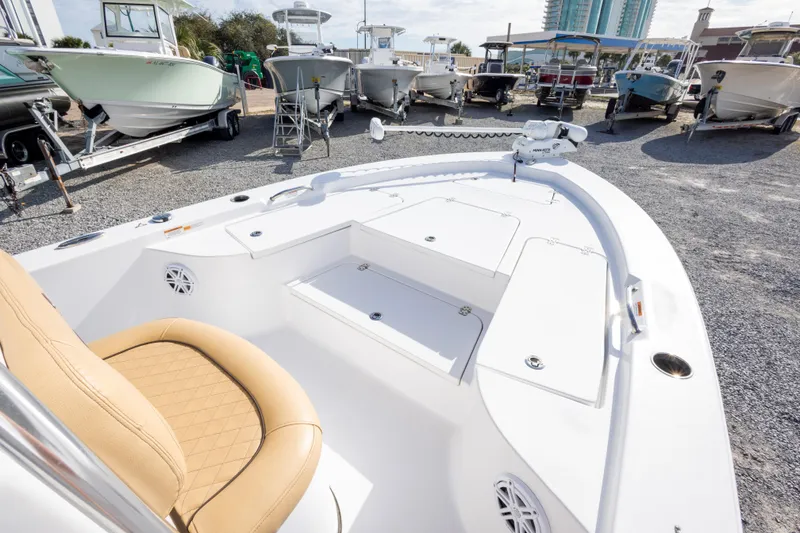 Slide: The Image of 2021 Sportsman Masters 227 Bay Boat dashboard with steering wheel and controls. - 24