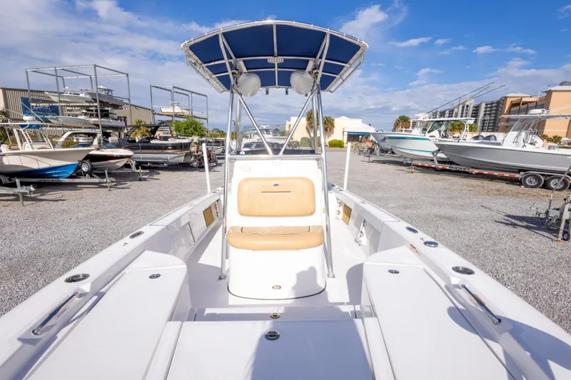 Slide: The Image of 2021 Sportsman Masters 227 Bay Boat with Minn Kota motor in a boatyard. - 29
