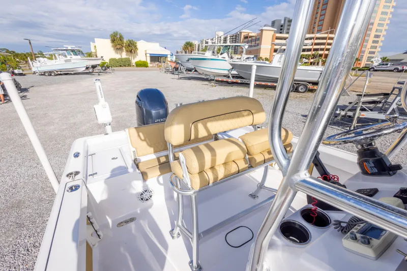 Slide: The Image of 2021 Sportsman Masters 227 Bay Boat interior wiring and storage compartment. - 32