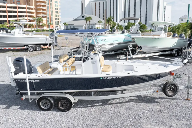Slide: The Image of 2021 Sportsman Masters 227 Bay Boat on trailer in marina parking lot. - 34